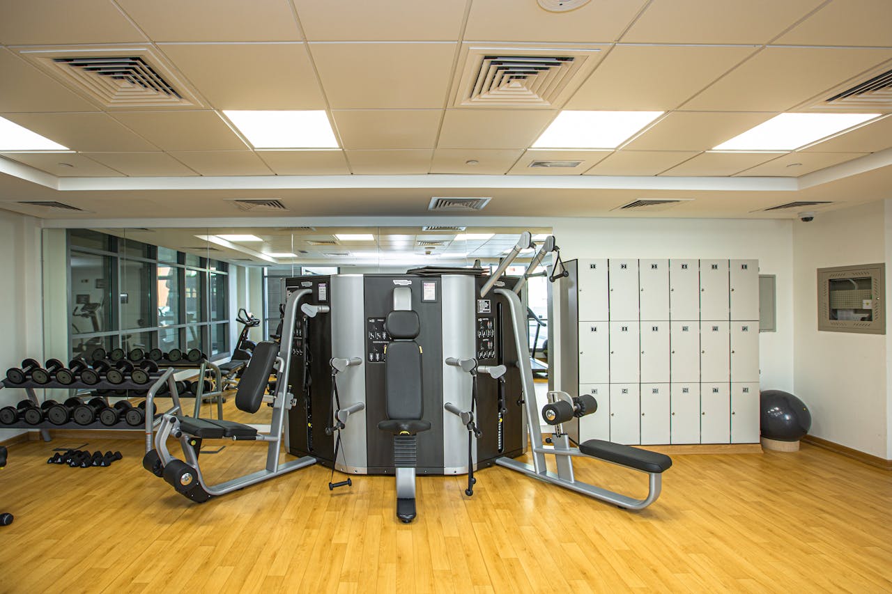 our-story Spacious gym interior showcasing modern exercise equipment and storage lockers.